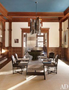 LANDING On a landing, a 1970s Charles Paris light fixture is suspended above a table by Hayes and Aesthetic Movement chairs; the large bronze water bowl is Japanese.