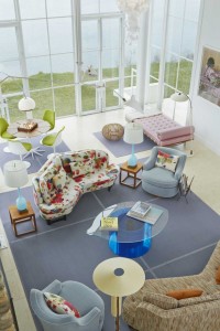 This Shelter Island residence features two Edward Wormley corner sofas for Dunbar, of similar shape but slightly different proportions, covered in two very different fabrics. Swivel chairs, also by Wormley, are covered in light-blue velvet and are arranged around a coffee table in the shape of an eye, designed by Nicola L. A large FilzFelt rug completes the room’s main seating area. (Credit: Courtesy of The Monacelli Press / Anastassios Mentis)